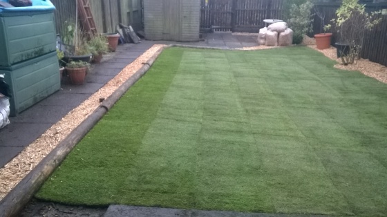 laying turf and fence building