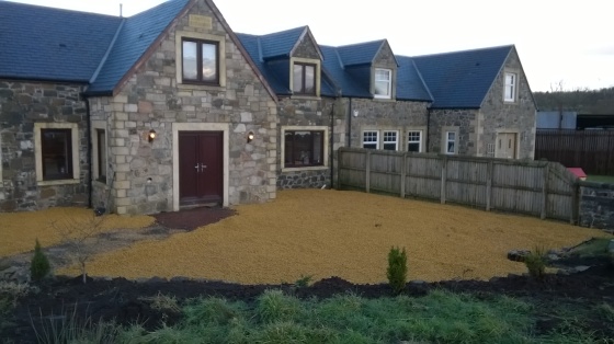 landscaping and planting a border, laying slabs