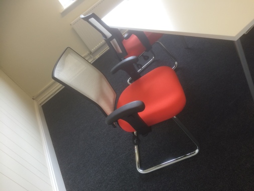 White Table with Orange Meeting chairs installed by us in Huddersfield