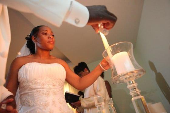 Unity Candle Ceremony- Represents the union of 2 becoming one.