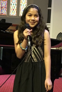 a student performing at one of our two yearly concerts 