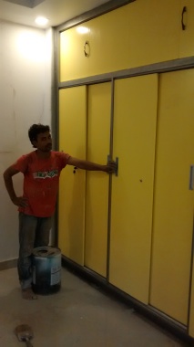 A sliding door wardrobe, with loft. The material is high density MDF,  and finished with pigmented p.u.