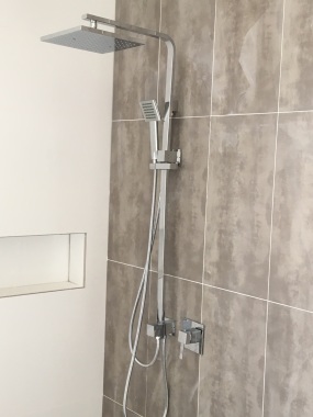 Beautiful new shower with tiling, gorgeous shower heads and setup..JPG
