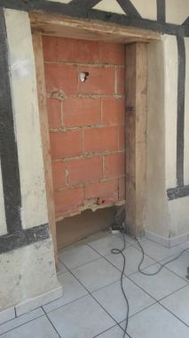 ouverture dans un mur avec renforcement portique bois