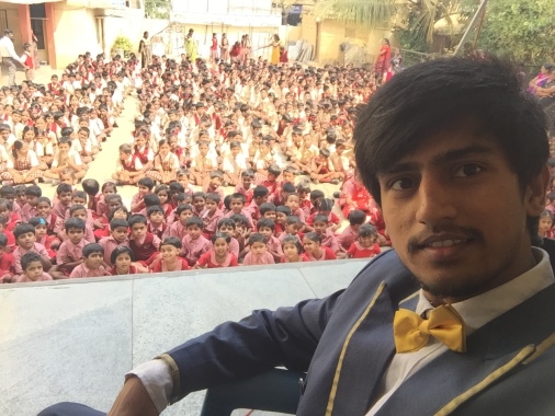 Magician idris selfie with school children
